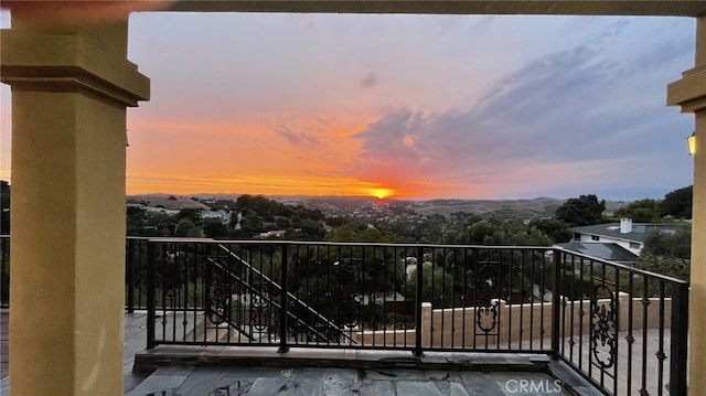 view of balcony at dusk