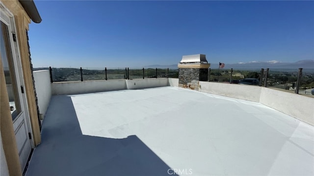 view of terrace with a mountain view