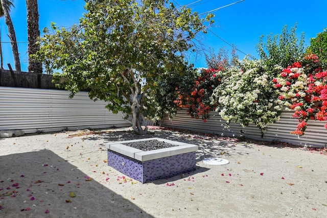 view of patio / terrace featuring a fire pit