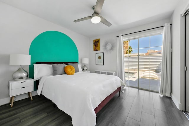 bedroom featuring ceiling fan, dark hardwood / wood-style floors, and access to exterior