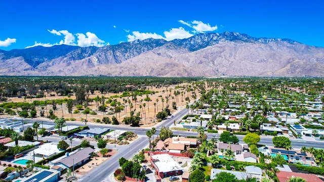 birds eye view of property featuring a mountain view