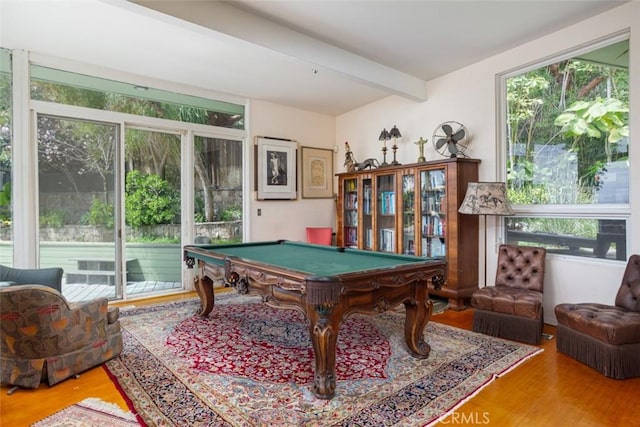 game room with hardwood / wood-style floors, beam ceiling, and billiards