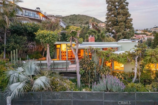 rear view of property featuring a mountain view