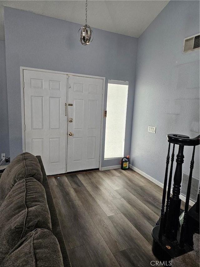 entrance foyer with dark hardwood / wood-style flooring