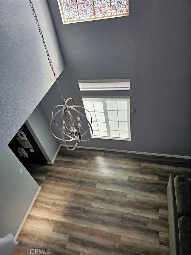 interior space featuring a notable chandelier and wood-type flooring