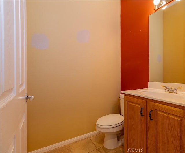 bathroom with tile patterned floors, vanity, and toilet