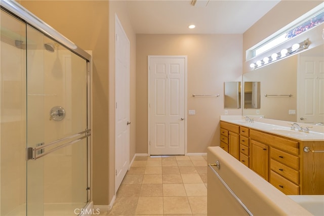 bathroom featuring tile patterned floors, vanity, and an enclosed shower