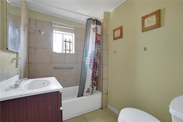 full bathroom with tile patterned flooring, vanity, shower / bath combo, and toilet