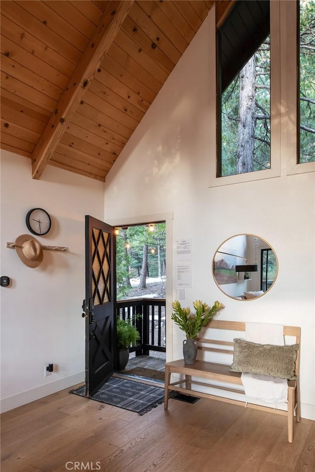 entryway featuring beamed ceiling, hardwood / wood-style flooring, high vaulted ceiling, and wooden ceiling