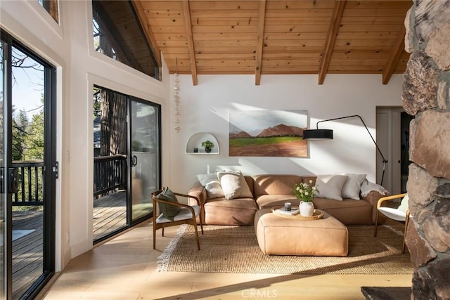 interior space featuring beamed ceiling, high vaulted ceiling, and wooden ceiling