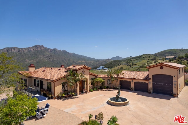 view of front of home featuring a mountain view