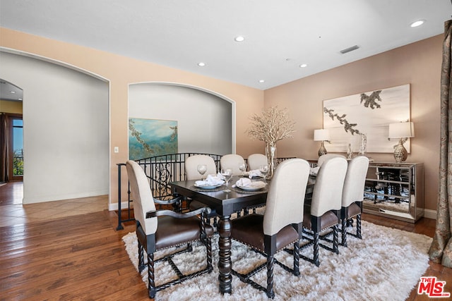 dining space with dark hardwood / wood-style floors