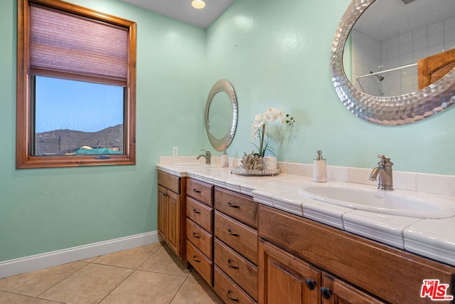 bathroom with tile patterned floors and vanity