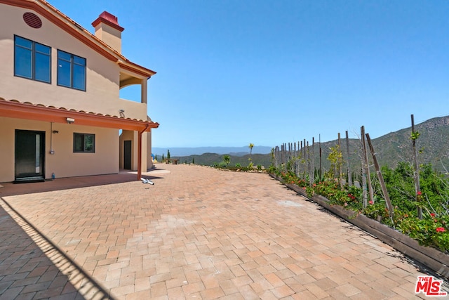 view of patio with a mountain view