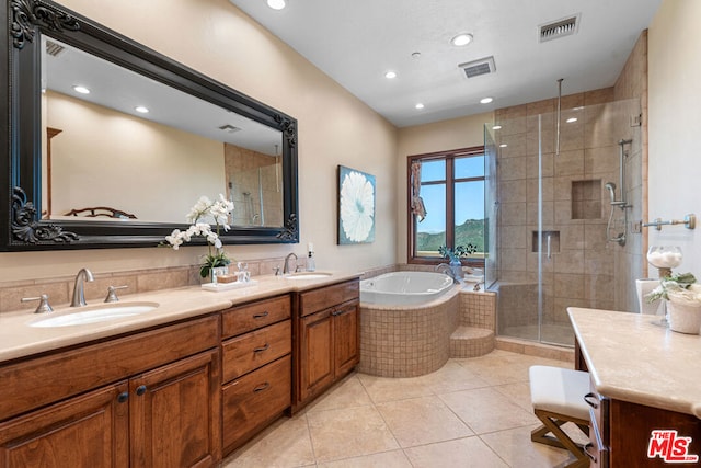 bathroom with independent shower and bath, tile patterned flooring, and vanity