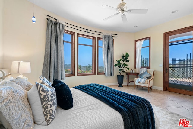 tiled bedroom with ceiling fan