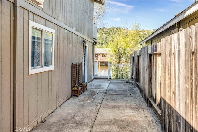 view of property exterior with a patio area