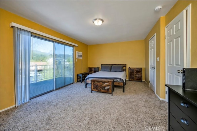 carpeted bedroom with access to outside