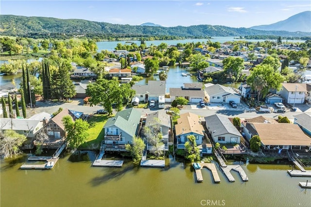 bird's eye view featuring a water and mountain view