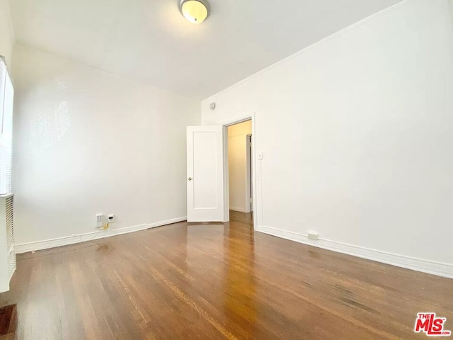 empty room featuring wood-type flooring