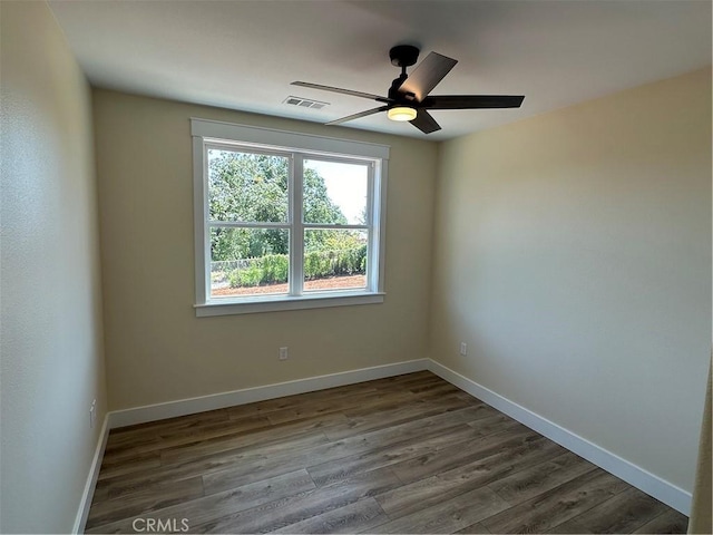 empty room featuring hardwood / wood-style flooring and ceiling fan