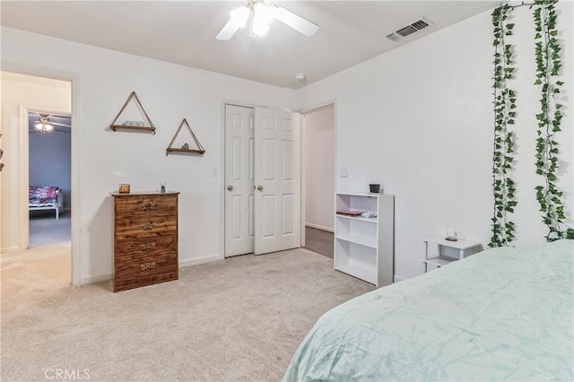 bedroom with carpet flooring, a closet, and ceiling fan