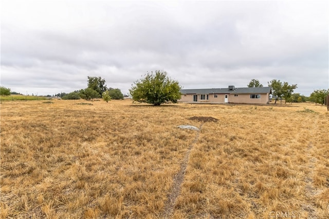 view of yard with a rural view