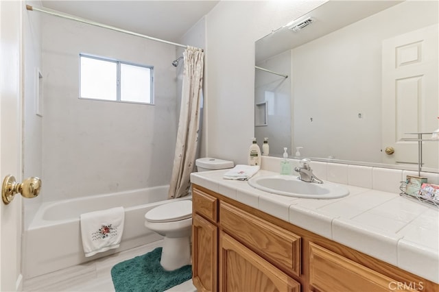 full bathroom featuring vanity, shower / bath combination with curtain, and toilet