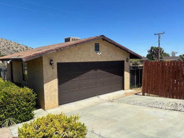 garage featuring fence