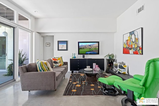 living room with concrete floors