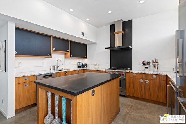 kitchen with wall chimney exhaust hood, a center island, high end stove, and sink