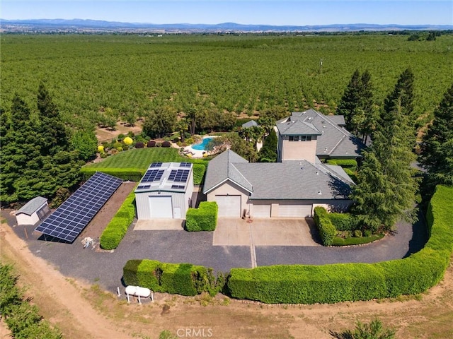 birds eye view of property with a forest view