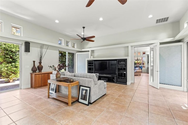 living area featuring recessed lighting, visible vents, ceiling fan, and light tile patterned flooring