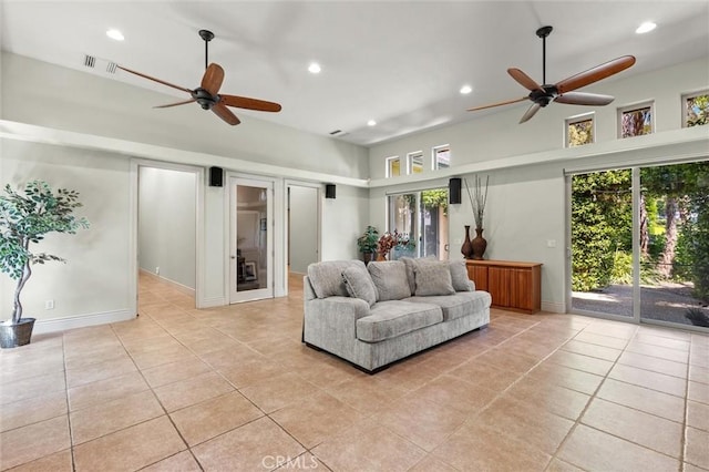 living room with light tile patterned floors, baseboards, visible vents, and recessed lighting