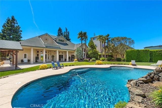 view of swimming pool featuring a patio area and a fenced in pool