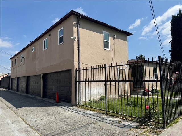 view of property exterior featuring a garage