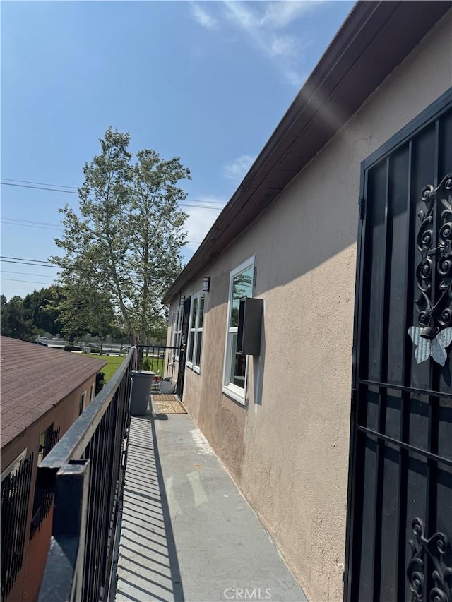 view of property exterior featuring a balcony