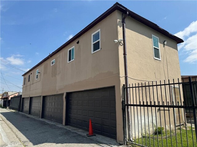 view of side of home with a garage