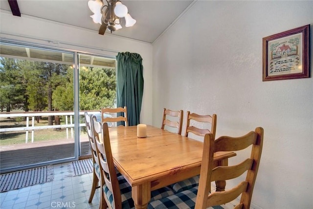 dining space featuring crown molding