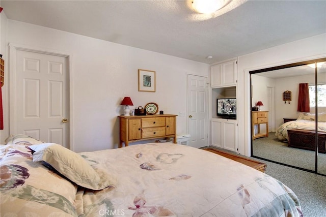 bedroom with carpet floors and a closet