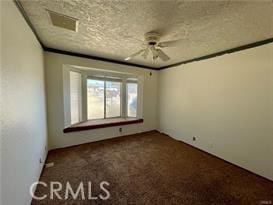 carpeted empty room with ceiling fan