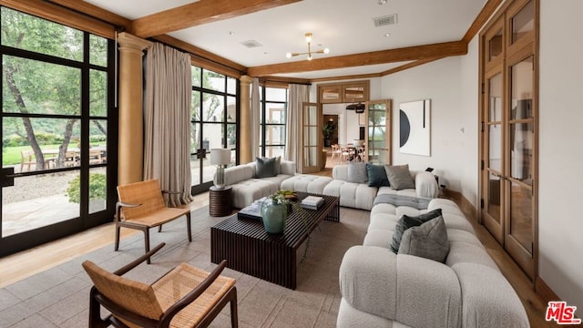 interior space featuring an inviting chandelier, french doors, and beamed ceiling