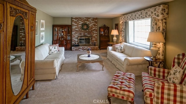 carpeted living room featuring a brick fireplace