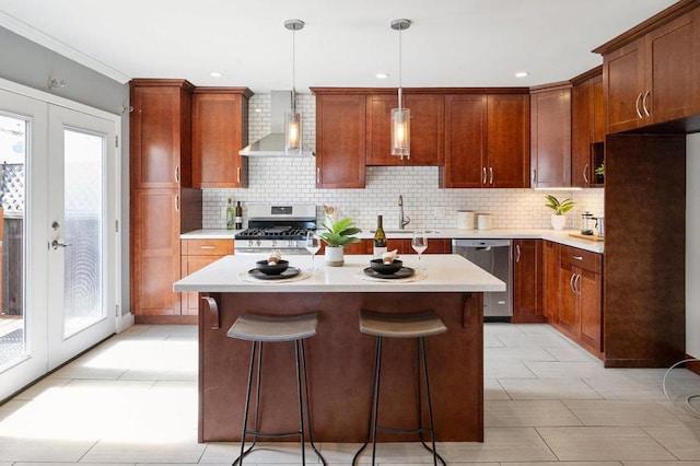 kitchen featuring wall chimney exhaust hood, gas range oven, light tile flooring, dishwasher, and tasteful backsplash