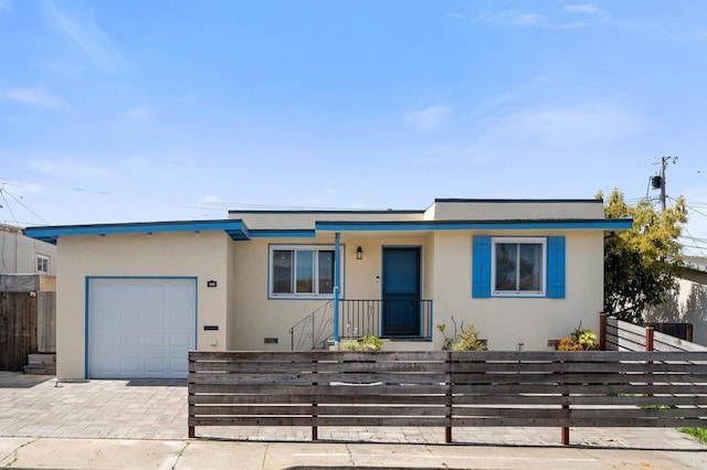 view of front of property featuring a garage