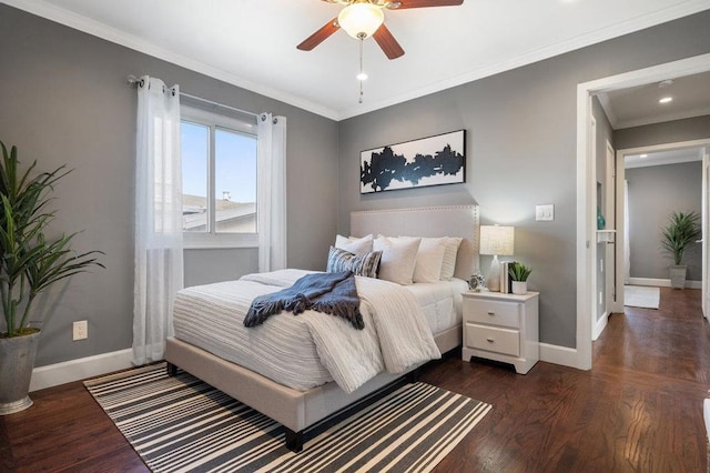 bedroom with ornamental molding, ceiling fan, and dark hardwood / wood-style floors