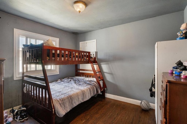 bedroom with hardwood / wood-style floors