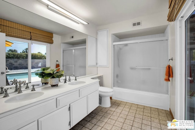 full bathroom with toilet, combined bath / shower with glass door, and vanity