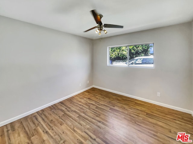 spare room featuring ceiling fan and wood-type flooring