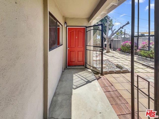 property entrance featuring a patio